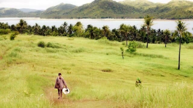 Corregidor Island beach with lush green hills in Siargao